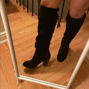Knee high slouchy black heeled boots